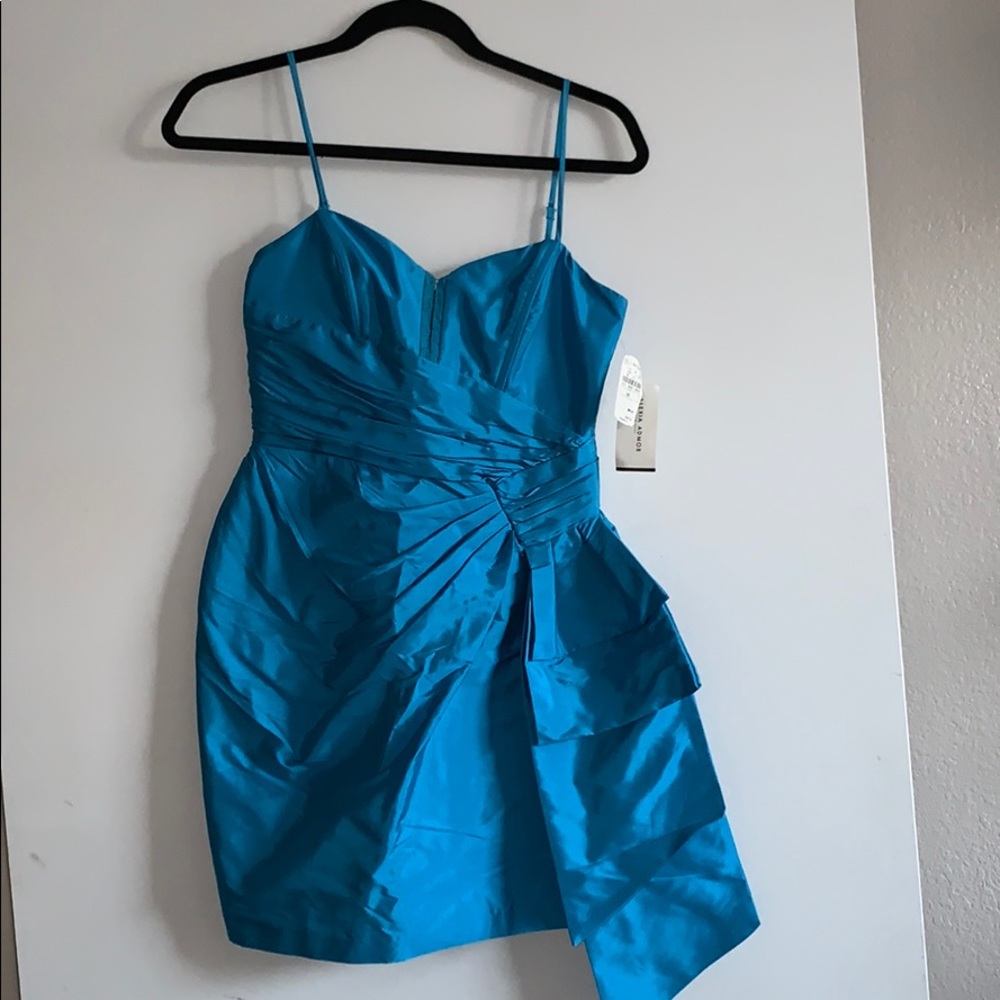 Turquoise taffeta dress.